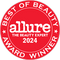 Rotes rundes Siegel mit der Aufschrift „Best of Beauty Award Winner 2024 Allure The Beauty Expert“ in weißer Schrift.