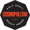 Schwarzes achteckiges Abzeichen mit dem Cosmopolitan Holy Grail Beauty Award 2021 in fettem rot-weißem Text.