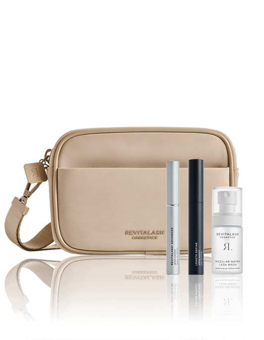 Die Strength & Define Collection – RevitaLash® Advanced von RevitaLash® Cosmetics bestehend aus beigefarbener Kosmetiktasche, RevitaLash® Advanced, Length Define Tubing Mascara und Micellar Water Lash Wash.