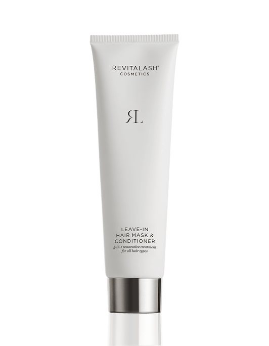 Eine weiße Tube RevitaLash Germany Leave-In Hair Mask & Conditioner mit einer silbernen Kappe, aufrecht stehend.